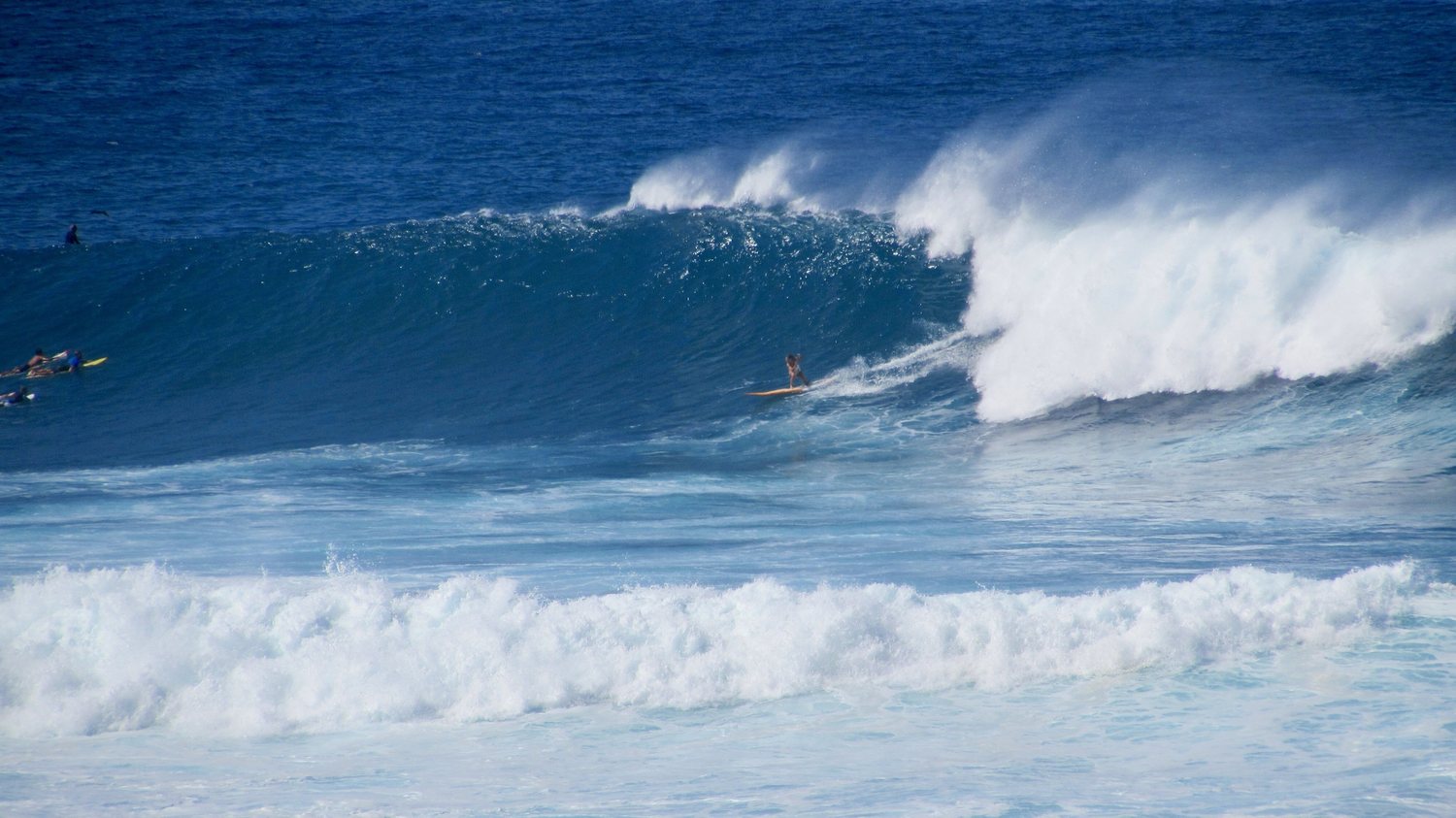 Bri surfing a big, powerful wave